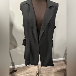 Black lined vest with side belts